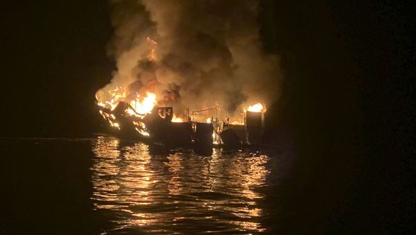 In this photo provided by the Santa Barbara County Fire Department, a dive boat is engulfed in flames after a deadly fire broke out aboard the commercial scuba diving vessel off the Southern California Coast, Monday morning, Sept. 2, 2019 - Sputnik International