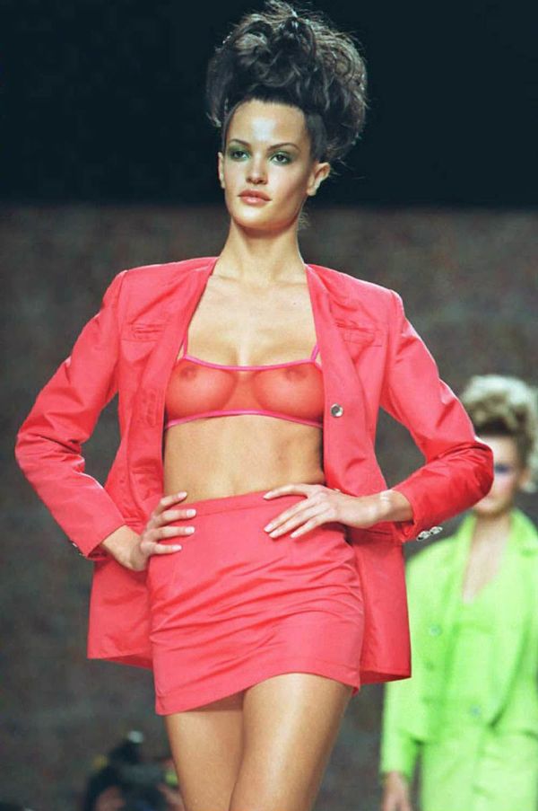 A model wears a red jacket and matching skirt over a see-through red bra at the Todd Oldham Spring 1996 fashion show 31 October in New York. A model wears a red jacket and matching skirt over a see-through red bra at the Todd Oldham Spring 1996 fashion show 31 October in New York. - Sputnik International