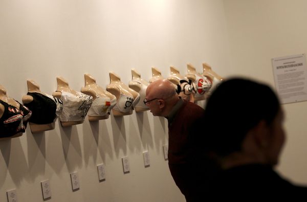 A visitor looking at an exhibit item The country's history from Kutuzov to Putin on bras during the opening day of an exhibition by Andrei Biljo at the Moscow Museum of Modern Art. A visitor looking at an exhibit item The country's history from Kutuzov to Putin on bras during the opening day of an exhibition by Andrei Biljo at the Moscow Museum of Modern Art. - Sputnik International