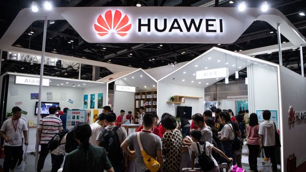 In this file photo taken on August 2, 2019 Attendees visit a Huawei exhibition stand during the Consumer Electronics Expo in Beijing In this file photo taken on August 2, 2019 Attendees visit a Huawei exhibition stand during the Consumer Electronics Expo in Beijing - Sputnik International
