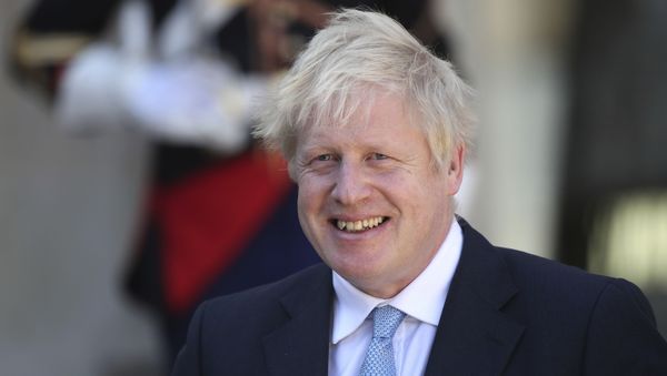 Britain's Prime Minister Boris Johnson smiles after being greeted by French President Emmanuel Macron at the Elysee Palace, Thursday, Aug. 22, 2019 in Paris - Sputnik International