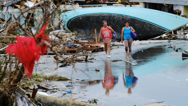Women walk through the rubble in the aftermath of Hurricane Dorian on the Great Abaco island town of Marsh Harbour, Bahamas, September 3, 2019.  - Sputnik International