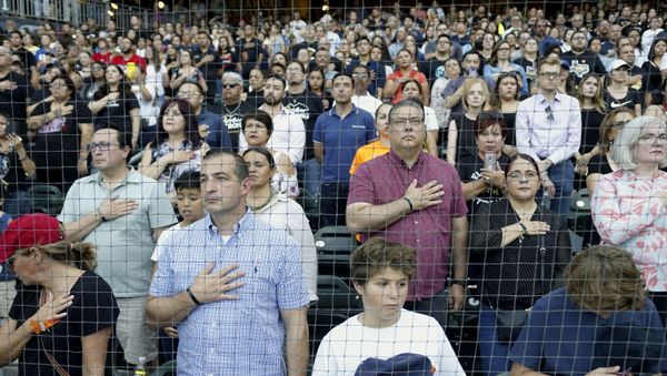 People attend a community memorial service honoring victims of the mass shooting earlier this month which left 22 people dead and 24 more injured, at Southwest University Park on August 14, 2019 in El Paso, Texas. - Sputnik International