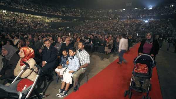 Muslims from several countries gather to listen to speakers during an Islamic religious meeting in Antwerp on April 12, 2009 - Sputnik International