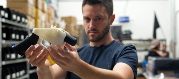 Cody Wilson, owner of Defense Distributed company, holds a 3D printed gun, called the Liberator, in his factory in Austin, Texas on August 1, 2018 Cody Wilson, owner of Defense Distributed company, holds a 3D printed gun, called the Liberator, in his factory in Austin, Texas on August 1, 2018 - Sputnik International