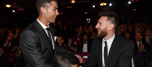 Nominees for the Best FIFA football player, Barcelona and Argentina forward Lionel Messi (R) and Real Madrid and Portugal forward Cristiano Ronaldo (L) chat before taking their seats for The Best FIFA Football Awards ceremony, on October 23, 2017 in London - Sputnik International