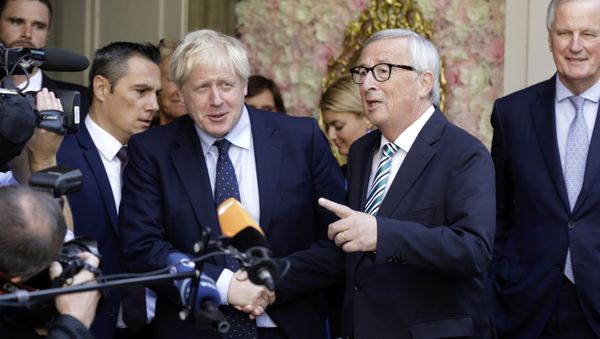 European Commission President Jean-Claude Juncker, center right, speaks with the media as he shakes hands with British Prime Minister Boris Johnson prior to a meeting at a restaurant in Luxembourg, Monday, Sept. 16, 2019 European Commission President Jean-Claude Juncker, center right, speaks with the media as he shakes hands with British Prime Minister Boris Johnson prior to a meeting at a restaurant in Luxembourg, Monday, Sept. 16, 2019 - Sputnik International