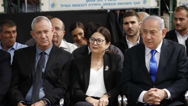 Blue and White party leader Benny Gantz, left, Esther Hayut, the Chief Justice of the Supreme Court of Israel, and Prime Minister Benjamin Netanyahu attend a memorial service for former President Shimon Peres in Jerusalem, Thursday, Sept. 19, 2019. Israelis are contending with the prospect of a third election, two days after an unprecedented repeat election left the country's two main political parties deadlocked, with neither Prime Minister Benjamin Netanyahu nor his rivals holding a clear path to a coalition government. (AP Photo/Ariel Schalit) Blue and White party leader Benny Gantz, left, Esther Hayut, the Chief Justice of the Supreme Court of Israel, and Prime Minister Benjamin Netanyahu attend a memorial service for former President Shimon Peres in Jerusalem, Thursday, Sept. 19, 2019. Israelis are contending with the prospect of a third election, two days after an unprecedented repeat election left the country's two main political parties deadlocked, with neither Prime Minister Benjamin Netanyahu nor his rivals holding a clear path to a coalition government. (AP Photo/Ariel Schalit) - Sputnik International