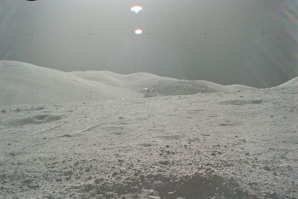 The crater containing sample 70019, with the Apollo 17 lunar module in the background. - Sputnik International