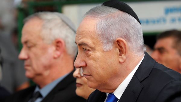 Israeli Prime Minister Benjamin Netanyahu looks on as he sits next to Benny Gantz, leader of Blue and White party, during a memorial ceremony for late Israeli President Shimon Peres, at Mount Herzl in Jerusalem September 19, 2019. REUTERS/Ronen Zvulun Israeli Prime Minister Benjamin Netanyahu looks on as he sits next to Benny Gantz, leader of Blue and White party, during a memorial ceremony for late Israeli President Shimon Peres, at Mount Herzl in Jerusalem September 19, 2019. REUTERS/Ronen Zvulun - Sputnik International
