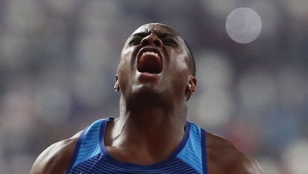 Athletics - World Athletics Championships - Doha 2019 - Men's 100 Metres Final - Khalifa International Stadium, Doha, Qatar - September 28, 2019 Christian Coleman of the U.S. celebrates winning gold in the final REUTERS/Lucy Nicholson - Sputnik International