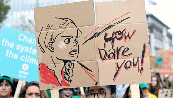 A participant holds a drawing depicting Swedish environmental activist Greta Thunberg during a protest march to call for action against climate change, in The Hague, Netherlands September 27, 2019 - Sputnik International