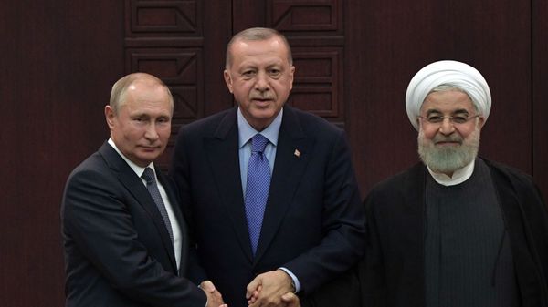 President of Russia Vladimir Putin, Turkish President Recep Tayyip Erdogan and Iranian President Hassan Rouhani during a joint press conference after the 5th Trilateral Summit in Astana format on the Syrian crisis   - Sputnik International