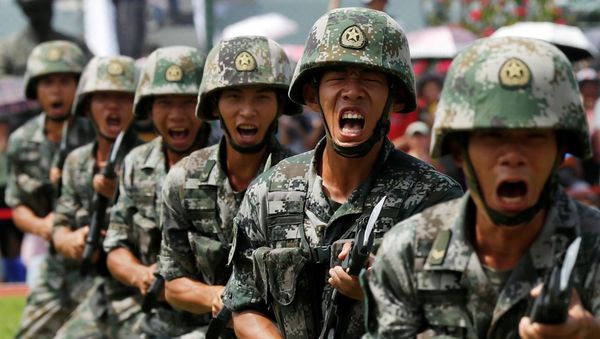 People's Liberation Army (PLA) soldiers take part in a performance during an open day at Stonecutters Island naval base in Hong Kong - Sputnik International