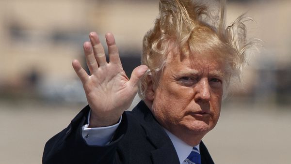 President Donald Trump waves as he boards Air Force One for a trip to White Sulphur Springs, W.Va., for an event on tax policy, Thursday, April 5, 2018, at Andrews Air Force Base, Md. - Sputnik International