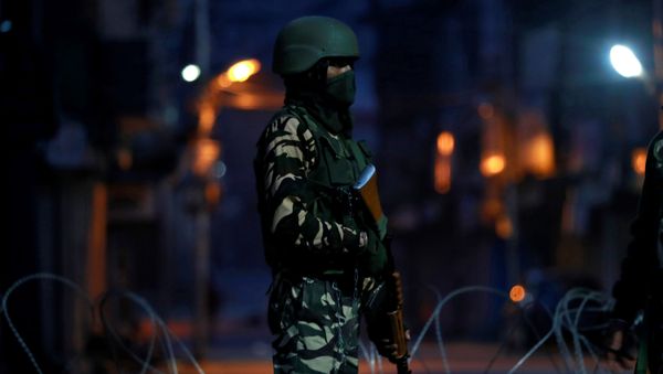An Indian security force personnel stands guard in a street early morning during restrictions following scrapping of the special constitutional status for Kashmir by the Indian government, in Srinagar, September 27, 2019 An Indian security force personnel stands guard in a street early morning during restrictions following scrapping of the special constitutional status for Kashmir by the Indian government, in Srinagar, September 27, 2019 - Sputnik International