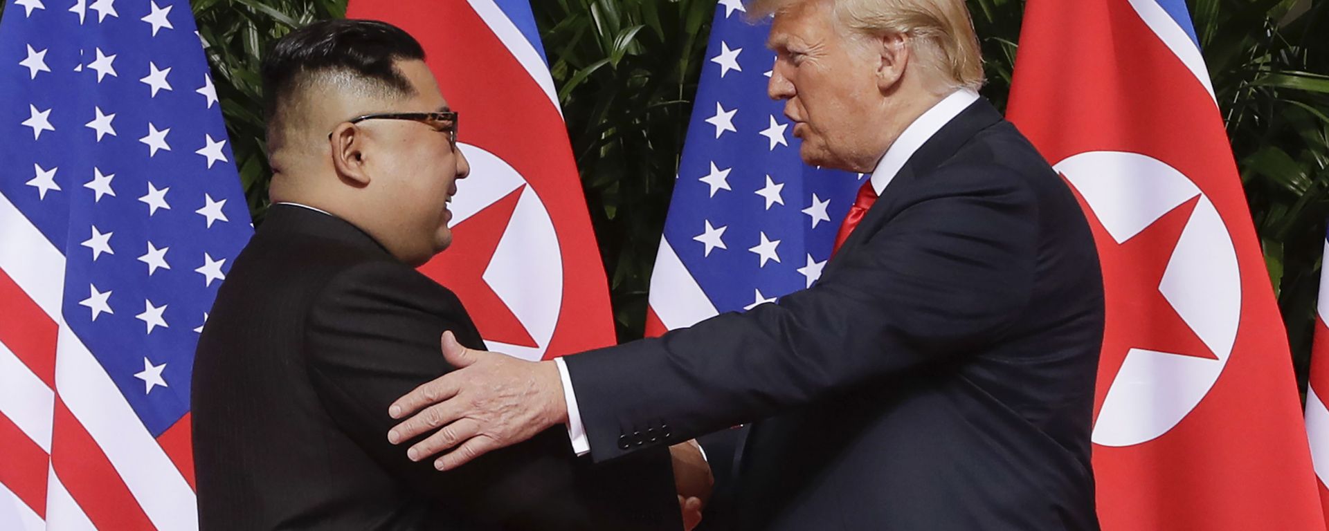 n this June 12, 2018 file photo, U.S. President Donald Trump, right, shakes hands with North Korea leader Kim Jong Un at the Capella resort on Sentosa Island in Singapore. Kim’s fifth meeting with Chinese President Xi Jinping continues his ambitious diplomatic outreach that has included summits with the leaders of the United States, South Korea and Russia in the past year and a half. Experts say Kim is attempting to form a united front with North Korea’s main ally China to strengthen his leverage in the stalled nuclear negotiations with the United States.  - Sputnik International, 1920, 13.06.2023