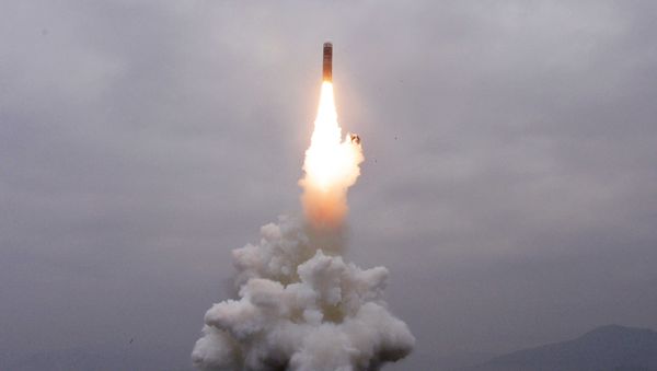 What appears to be a submarine-launched ballistic missile (SLBM) flies in an undisclosed location in this undated picture released by North Korea's Central News Agency (KCNA) on October 2, 2019 - Sputnik International