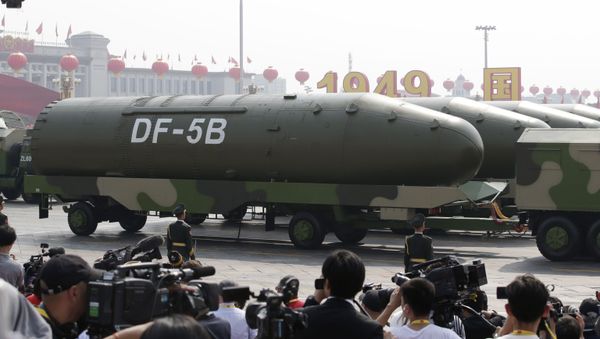 Military vehicles carrying DF-5B intercontinental ballistic missiles travel past Tiananmen Square during the military parade marking the 70th founding anniversary of People's Republic of China, on its National Day in Beijing, China October 1, 2019 - Sputnik International