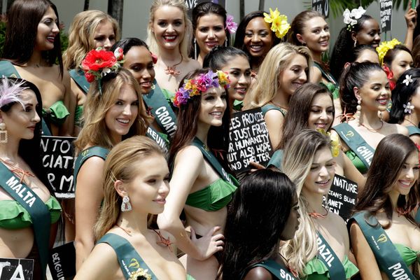 Candidates for the Miss Earth 2019 beauty pageant pose with their messages to save Mother Earth following their media presentation, Wednesday, Oct. 2, 2019 in Manila, Philippines.  - Sputnik International