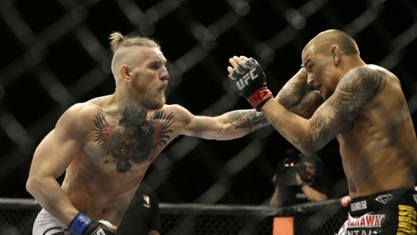 Conor McGregor, left, and Dustin Poirier, during their fight, Saturday, Sept. 27, 2014, in Las Vegas - Sputnik International