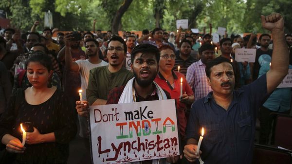 FILE- In this June 26, 2019 file photo, Indian protesters shout slogans as they hold placards and candles during a protest condemning mob lynching of Muslim youth Tabrez Ansari in Jharkhand state, in New Delhi, India - Sputnik International
