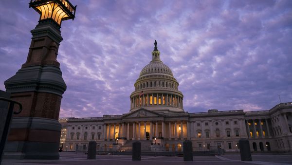 The Capitol in Washington is seen at dawn, 3 October 2019. House Democrats are moving quickly on the impeachment probe of President Donald Trump after a whistleblower exposed a July phone call the president had with Ukrainian President Volodymyr Zelenskiy in which Trump pressed for an investigation of political rival Joe Biden and his family. - Sputnik International