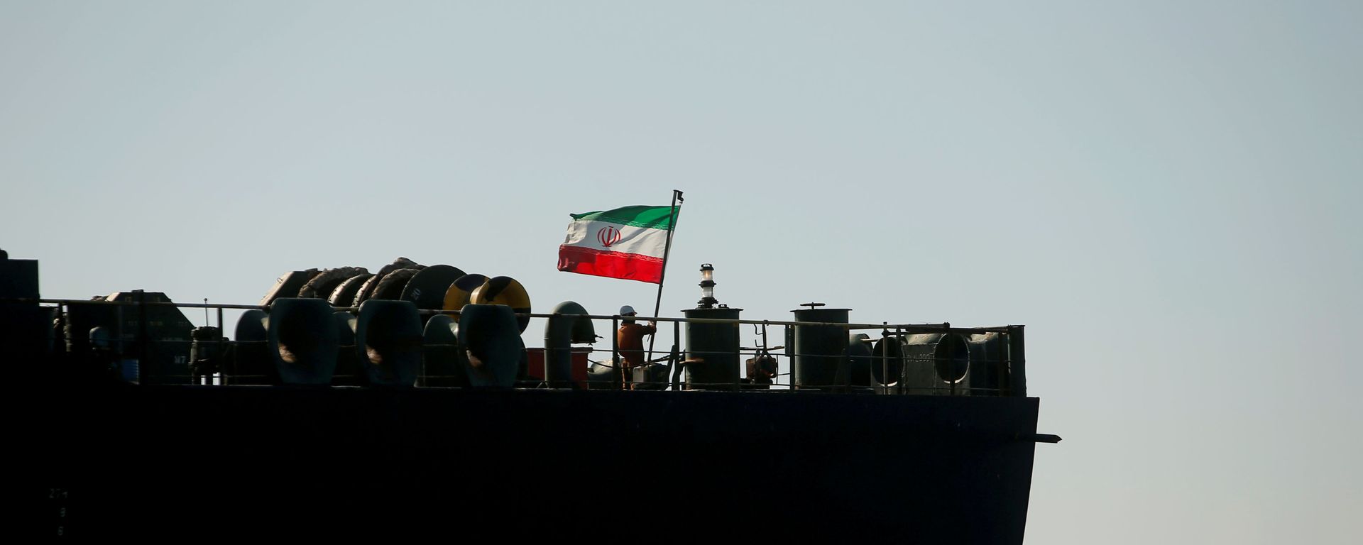 A crew member raises the Iranian flag at Iranian oil tanker Adrian Darya 1, formerly named Grace 1, as it sits anchored after the Supreme Court of the British territory lifted its detention order, in the Strait of Gibraltar, Spain, August 18, 2019. A crew member raises the Iranian flag at Iranian oil tanker Adrian Darya 1, formerly named Grace 1, as it sits anchored after the Supreme Court of the British territory lifted its detention order, in the Strait of Gibraltar, Spain, August 18, 2019. - Sputnik International, 1920, 19.03.2021