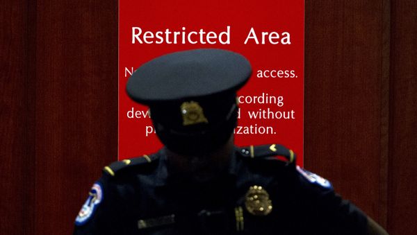 A U.S. Capitol Police officer stands at the entrance to a secure area during closed-door interviews with Kurt Volker, a former special envoy to Ukraine, as House Democrats proceed with the impeachment investigation of President Donald Trump, at the Capitol in Washington, Thursday, Oct. 3, 2019. A U.S. Capitol Police officer stands at the entrance to a secure area during closed-door interviews with Kurt Volker, a former special envoy to Ukraine, as House Democrats proceed with the impeachment investigation of President Donald Trump, at the Capitol in Washington, Thursday, Oct. 3, 2019. - Sputnik International