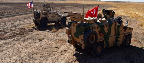 Turkish and U.S. military vehicles are seen on the Syrian-Turkish border during a joint U.S.-Turkey patrol near Tel Abyad, Syria, September 8, 2019 - Sputnik International