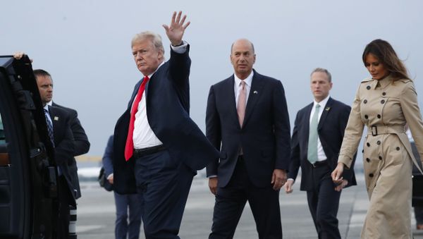 President Donald Trump, left, waves as he walks to his vehicle with Melania Trump, right, during their arrival on Air Force One at Melsbroek Air Base, Tuesday, July 10, 2018 in Brussels, Belgium. Walking with them is Ambassador Gordon D. Sondland, center - Sputnik International