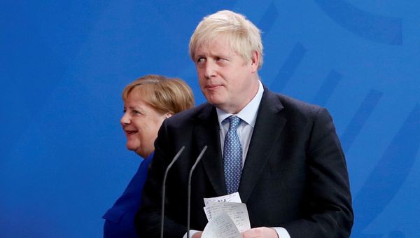 Britain's Prime Minister Boris Johnson holds his notes as he attends a news conference with German Chancellor Angela Merkel at the Chancellery in Berlin, Germany August 21, 2019.  - Sputnik International