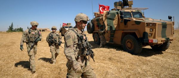 American soldiers walk together during a joint U.S.-Turkey patrol, near Tel Abyad, Syria September 8, 2019 - Sputnik International