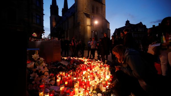 Mourners gather at the market square in Halle, Germany on 10 October 2019, after two people were killed in a shooting - Sputnik International