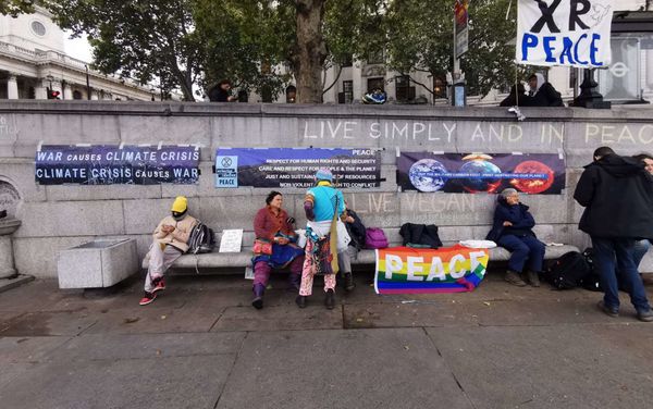 Activists from the Extinction Rebellion (XR) Peace group sit with banners at Trafalgar Square in London, UK on Friday, 11 October 2019 - Sputnik International