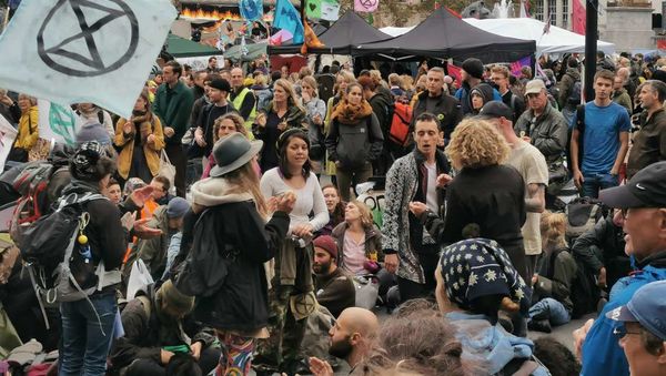 Activists begin chanting and singing at a sit-in in a major road outside Trafalgar Square in London, United Kingdom on Friday 11 October 2019 - Sputnik International
