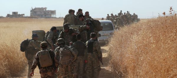 Turkey-backed Syrian rebel fighters are seen together in the village of Yabisa, near the Turkish-Syrian border, Syria, October 12, 2019.  - Sputnik International
