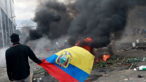 A demonstrator carries the Ecuadorian flag during a protest against Ecuador's President Lenin Moreno's austerity measures in Quito, Ecuador October 12, 2019. - Sputnik International