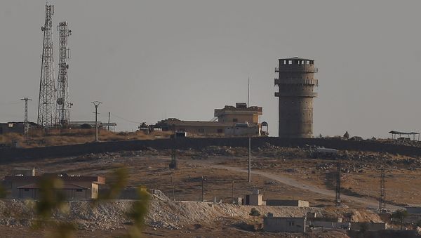 In this photo taken from the Turkish side of the border between Turkey and Syria, in Suruc, southeastern Turkey, a U.S forces outpost is seen on a hilltop outside Ayn Al Arab or Kobani, Syria, Saturday, Oct. 12, 2019.  - Sputnik International