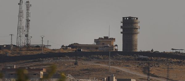 In this photo taken from the Turkish side of the border between Turkey and Syria, in Suruc, southeastern Turkey, a U.S forces outpost is seen on a hilltop outside Ayn Al Arab or Kobani, Syria, Saturday, Oct. 12, 2019.  - Sputnik International