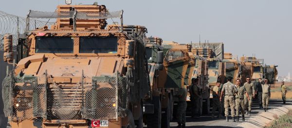 Turkish soldiers stand near military trucks in the village of Yabisa, near the Turkish-Syrian border, Syria, October 12, 2019. REUTERS/Khalil Ashawi - Sputnik International