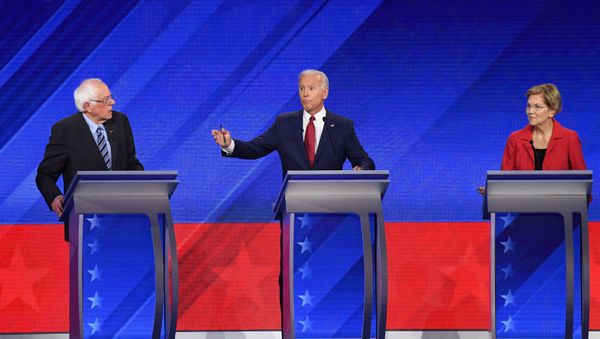 Democratic presidential hopefuls Vermont Senator Bernie Sanders (L), Former Vice President Joe Biden (C) and Massachusetts Senator Elizabeth Warren (R) speak during the third Democratic primary debate of the 2020 presidential campaign Democratic presidential hopefuls Vermont Senator Bernie Sanders (L), Former Vice President Joe Biden (C) and Massachusetts Senator Elizabeth Warren (R) speak during the third Democratic primary debate of the 2020 presidential campaign - Sputnik International