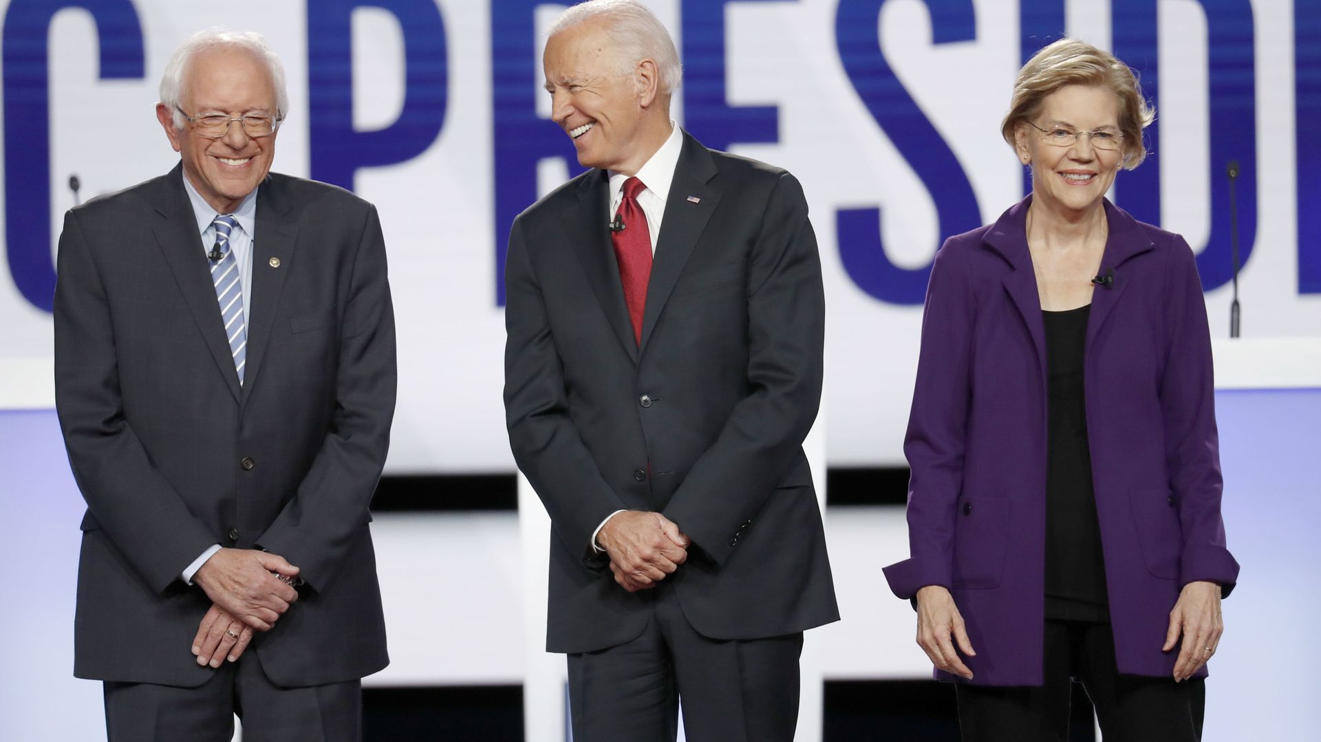 Democratic presidential candidate Sen. Bernie Sanders, I-Vt., former Vice President Joe Biden, center, and Sen. Elizabeth Warren, D-Mass., right, stand on stage before a Democratic presidential primary debate hosted by CNN and The New York Times at Otterbein University, Tuesday, Oct. 15, 2019, in Westerville, Ohio. Democratic presidential candidate Sen. Bernie Sanders, I-Vt., former Vice President Joe Biden, center, and Sen. Elizabeth Warren, D-Mass., right, stand on stage before a Democratic presidential primary debate hosted by CNN and The New York Times at Otterbein University, Tuesday, Oct. 15, 2019, in Westerville, Ohio. - Sputnik International, 1920, 20.07.2022