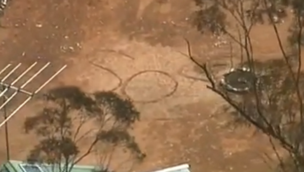 Remote Security Camera Detects Missing Australian’s ‘SOS’ Sign  Etched in Dirt - Sputnik International