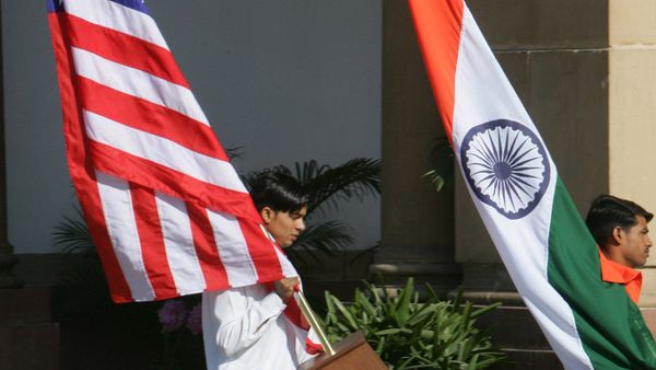 Indian workers carry the U.S. flag, left, and the Indian flag at Hyderabad House, the venue of the talks between U.S. President George W. Bush and Indian Prime Minister Manmohan Singh in New Delhi, India, Thursday, March 2, 2006 Indian workers carry the U.S. flag, left, and the Indian flag at Hyderabad House, the venue of the talks between U.S. President George W. Bush and Indian Prime Minister Manmohan Singh in New Delhi, India, Thursday, March 2, 2006 - Sputnik International