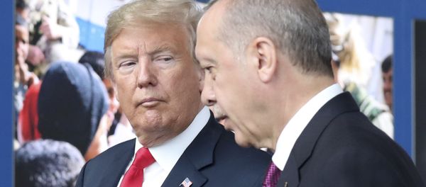 U.S. President Donald Trump, left, talks to Turkish President Recep Tayyip Erdogan as they tour the new NATO headquarters in Brussels, Belgium, Wednesday, July 11, 2018 - Sputnik International