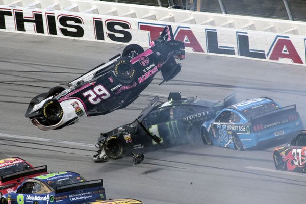Brendan Gaughan (62) flips in Turn 3 as driver Kurt Busch (1) and David Ragan (38) pass underneath during a NASCAR Cup Series auto race at Talladega Superspeedway, Monday, Oct 14, 2019, in Talladega, Ala. - Sputnik International
