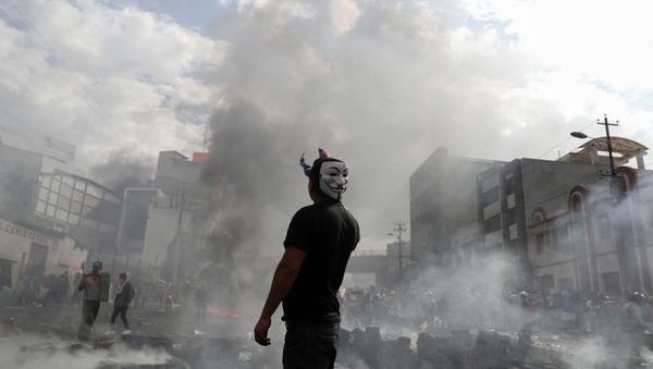 A demonstrator wearing an Anonymous mask takes part in a protest against Ecuador's President Lenin Moreno's austerity measures, in Quito, Ecuador October 12, 2019.   - Sputnik International