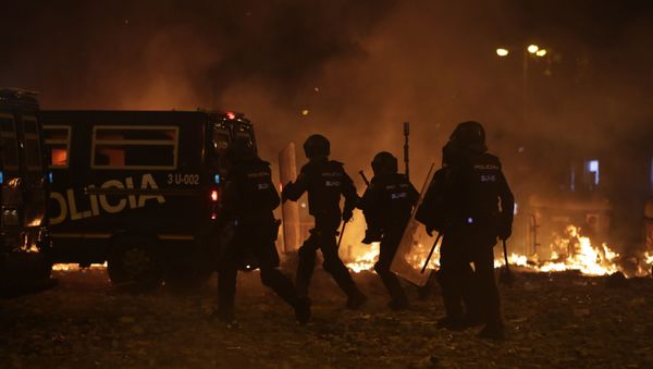 Police take position by burning barricades on the fifth day of protests over the conviction of a dozen Catalan independence leaders in Barcelona, Spain, Friday, Oct. 18, 2019. Police take position by burning barricades on the fifth day of protests over the conviction of a dozen Catalan independence leaders in Barcelona, Spain, Friday, Oct. 18, 2019. - Sputnik International