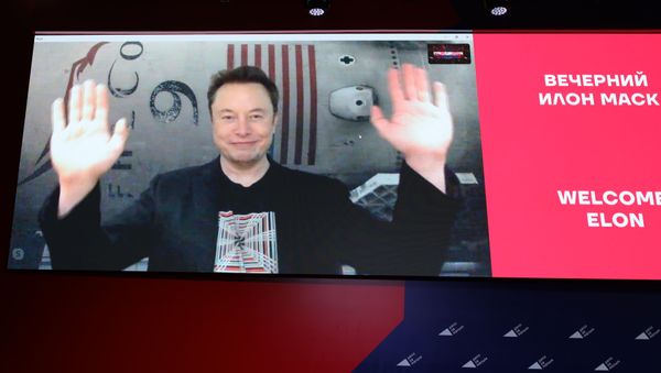 Elon Musk gestures as he speaks on a live Skype conference call at the annual business conference Delo za malym in Krasnodar, Russia on Friday, 18 October. Elon Musk gestures as he speaks on a live Skype conference call at the annual business conference Delo za malym in Krasnodar, Russia on Friday, 18 October. - Sputnik International